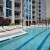 outdoor swimming pool surrounded by lounge chairs