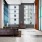 large, open lounge with high ceilings and massive windows